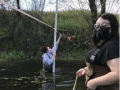 students take measurements in a creek