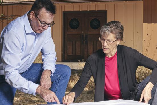 Claudia Luke & Greg Sarris looking at document
