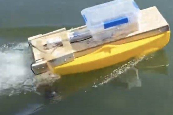 small unmanned boat on water