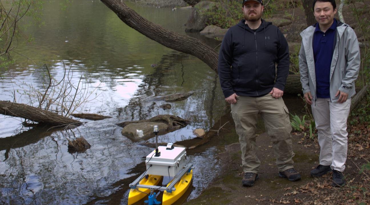 Researchers with research boat