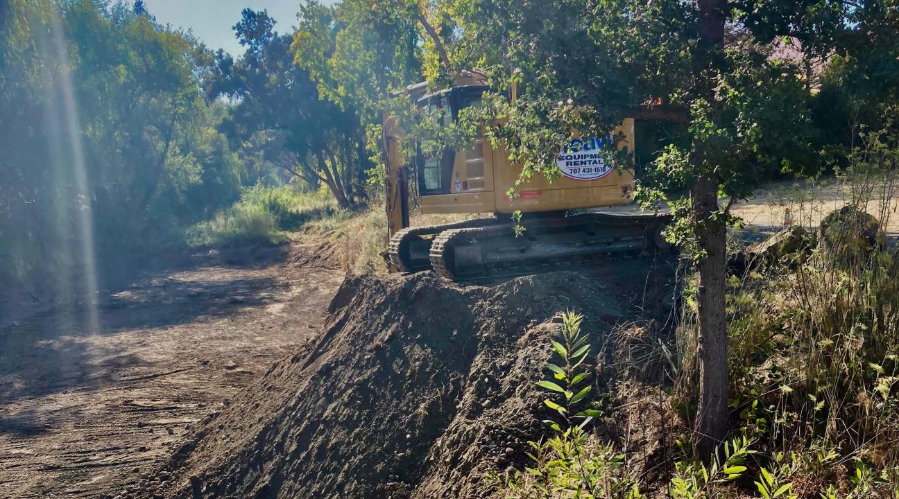 Bulldozers doing flood control along Copeland Creek in Rohnert Park