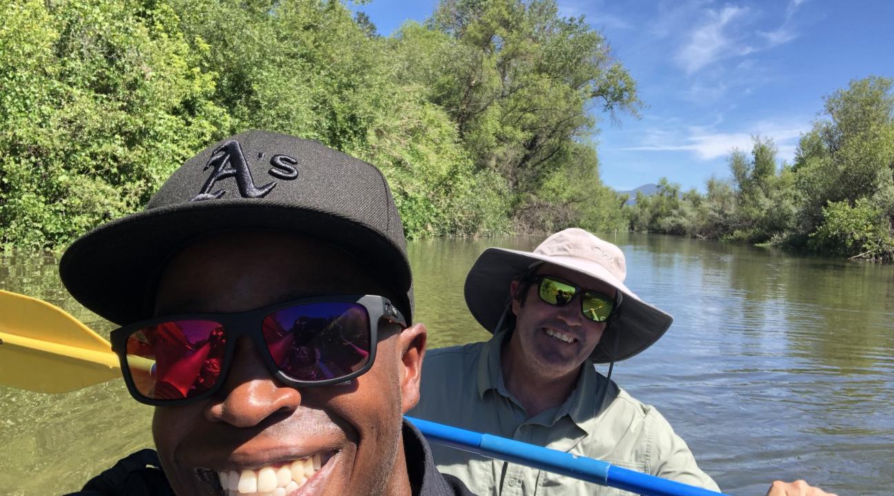 Dr. Manza Atkinson and researcher on boat