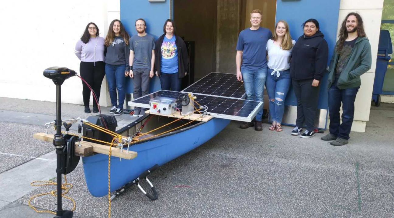 Students posing with their solar powered boat