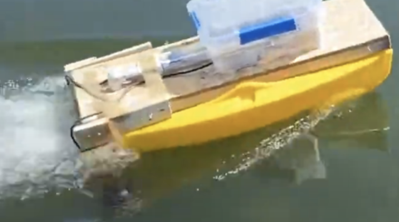 small unmanned boat on water