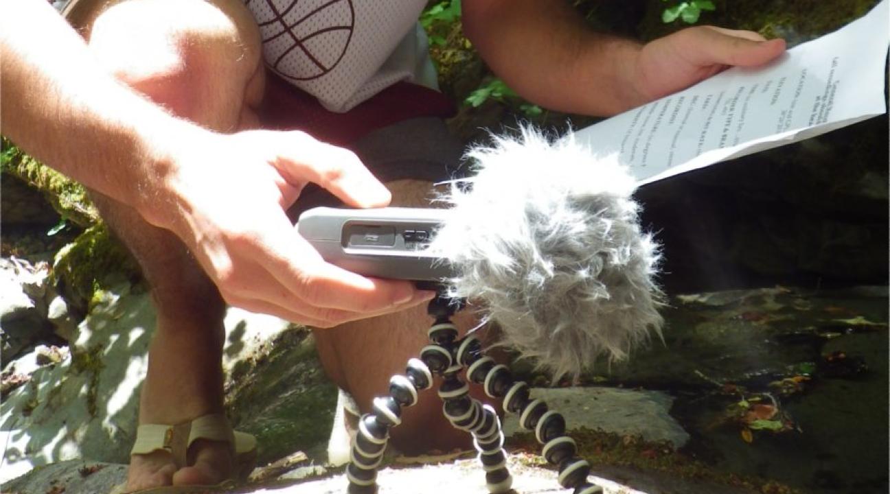 Student using equipment in the field