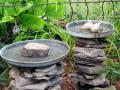 birdbaths made of plates and stones