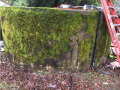 Moss-covered water tank