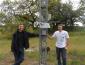 two students with newly installed weather station tower