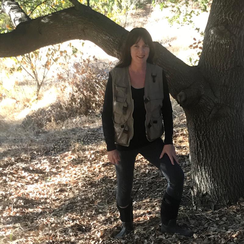 Woman standing in front of tree