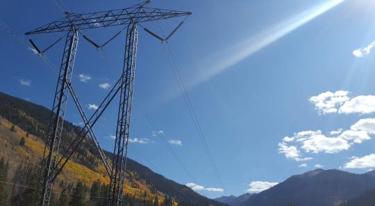 transmission power line in front of hill