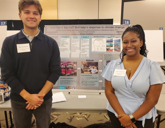 students stand in front of poster