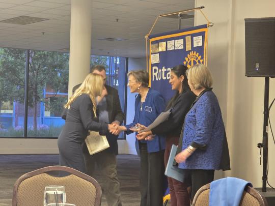 Claudia Luke accepting educator of the year award