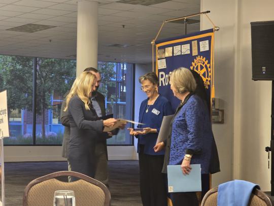 Claudia Luke accepting educator of the year award