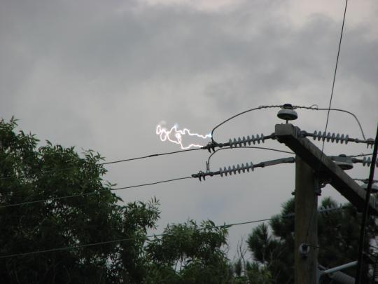 Arc of electricity between two power lines