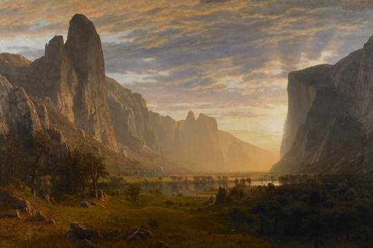 A painted landscape of a valley at sunset