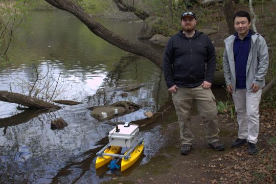 Researchers with research boat