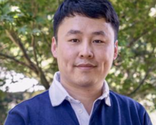 a man with short black hair