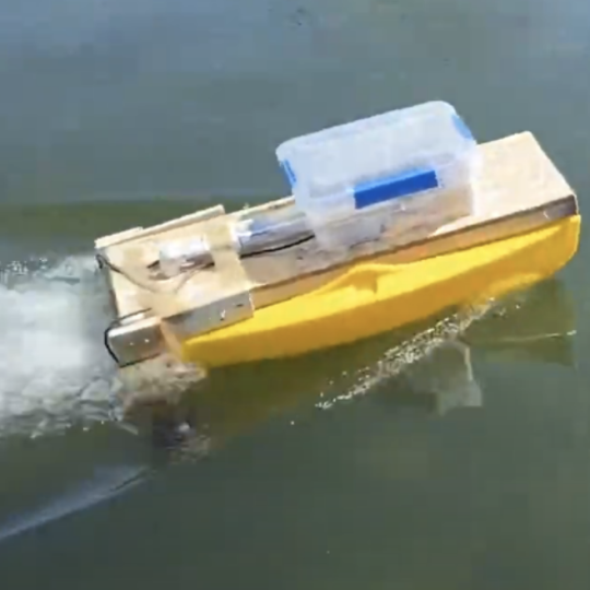 small unmanned boat on water